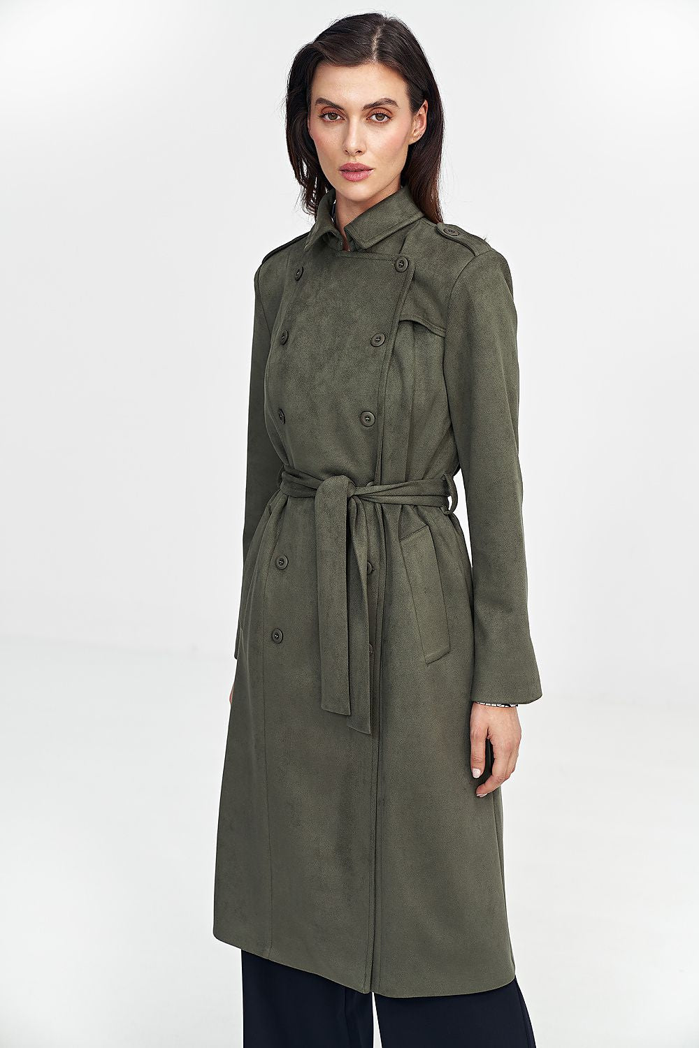 Woman wearing a green Aurivanne Nubuck Trench Coat with button details and shoulder epaulettes, showcasing stylish and warm outerwear.