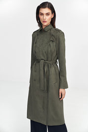 Woman wearing a green Aurivanne Nubuck Trench Coat with button details and shoulder epaulettes, showcasing stylish and warm outerwear.