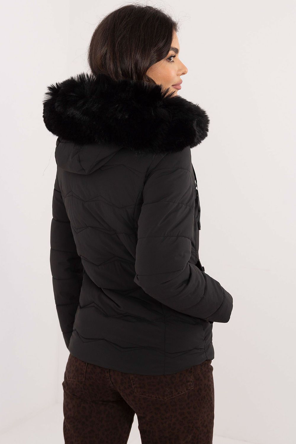 Back view of Veyra Short Quilted Jacket in black with detachable faux fur hood
