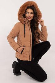 Veyra Short Quilted Jacket with faux fur hood, featuring light brown color, full front zipper, and contemporary quilted design for warmth.