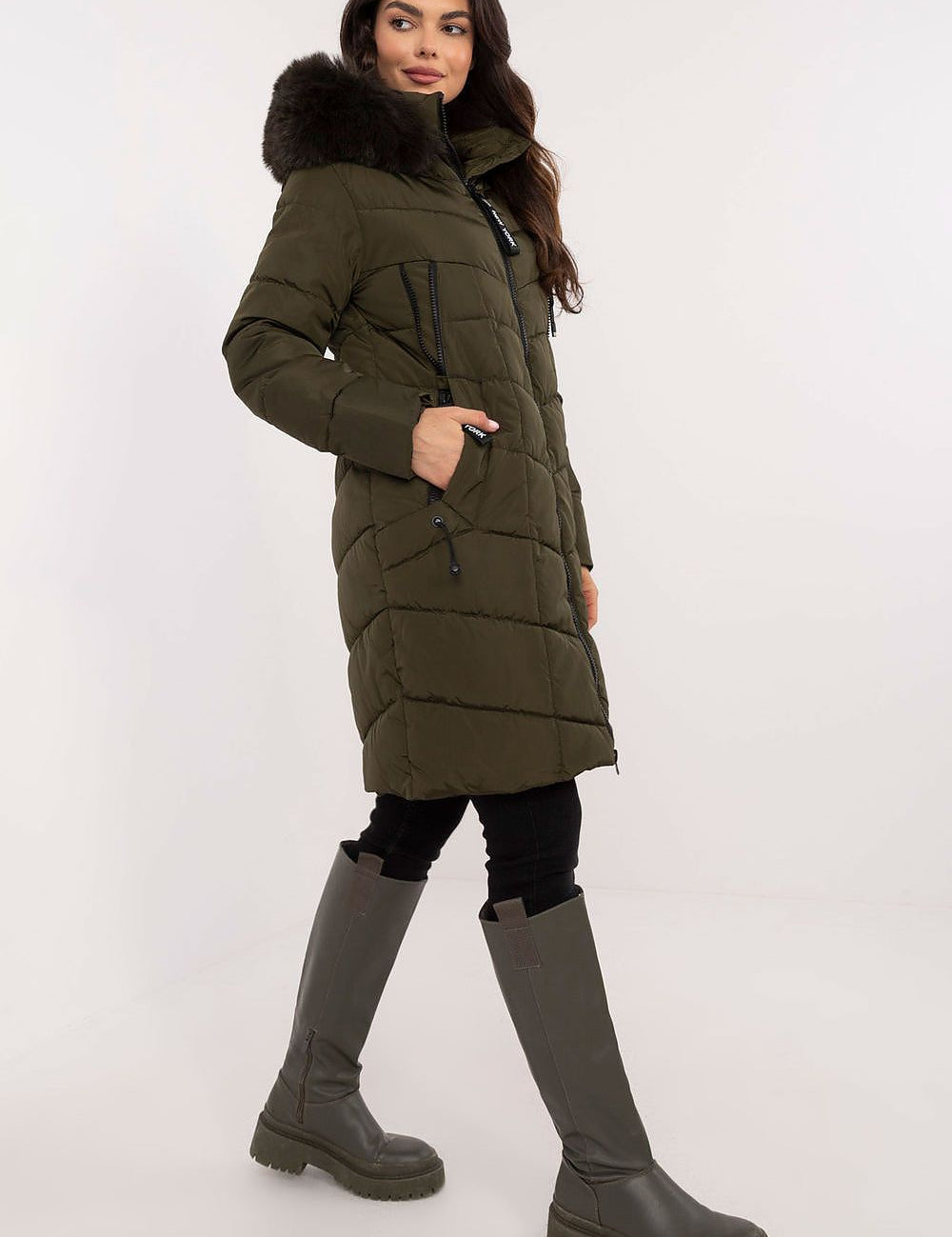 Model wearing Aurlis Quilted Winter Jacket with faux fur trim and knee-length coverage, perfect for stylish cold-weather protection.