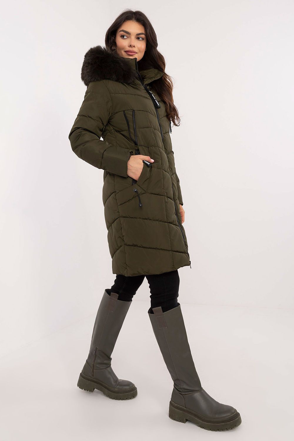 Model wearing Aurlis Quilted Winter Jacket with faux fur trim and knee-length coverage, perfect for stylish cold-weather protection.