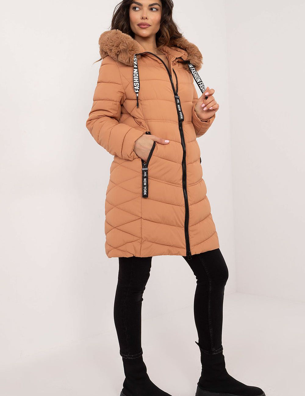 Woman wearing Frostveil Quilted Winter Jacket with faux fur trim, showcasing warmth and style for cold weather.