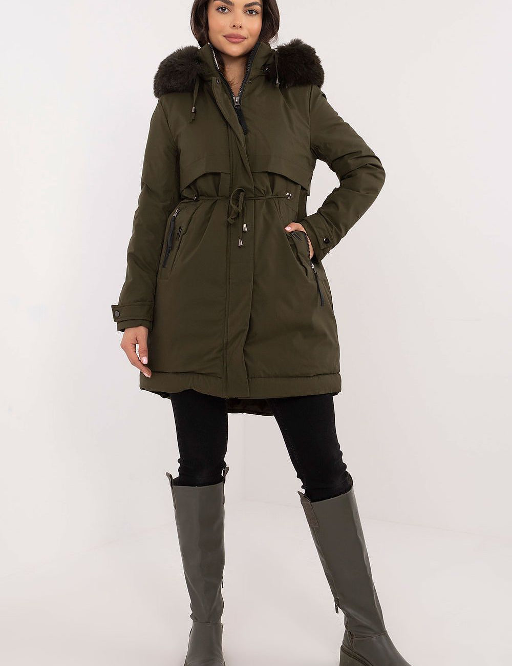 Woman wearing Frostveil Quilted Winter Jacket with faux fur trim and removable hood, styled for cold weather comfort and elegance.