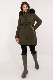 Woman wearing Frostveil Quilted Winter Jacket with faux fur trim and removable hood, showcasing modern style and practical warmth.