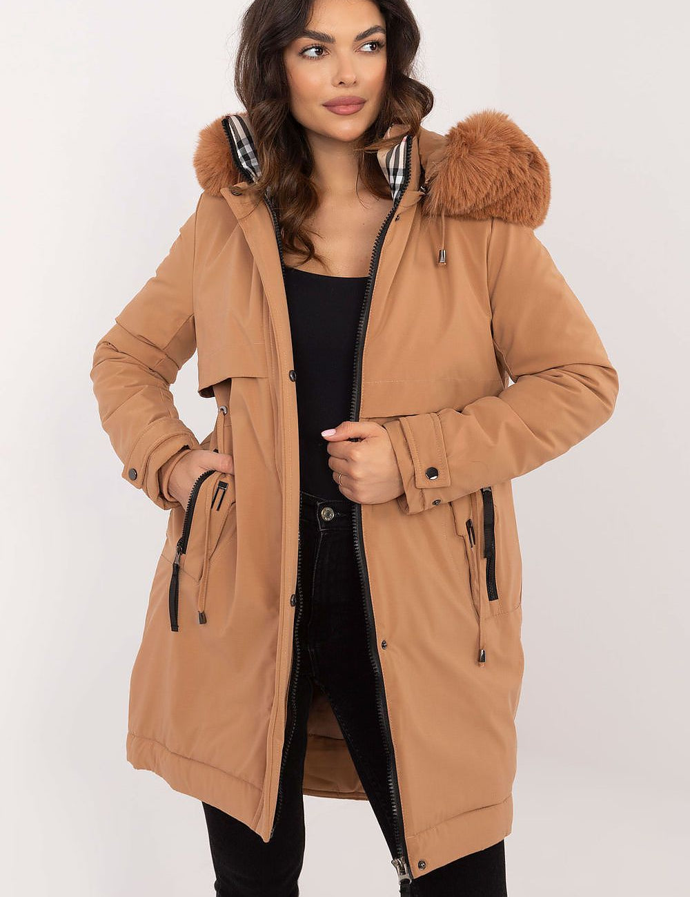 Woman wearing Frostveil Quilted Winter Jacket with faux fur trim and removable hood, showcasing modern style and warmth.