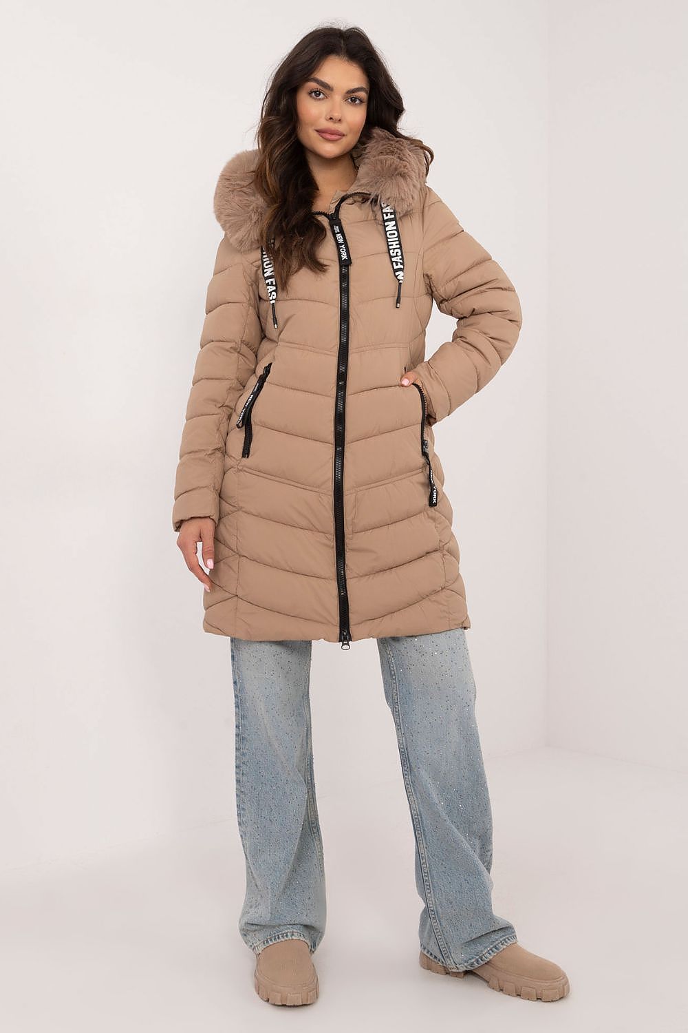 Frostveil Quilted Winter Jacket with faux fur trim, knee-length, zipper closure, worn by model. Stylish, warm, and practical outerwear.