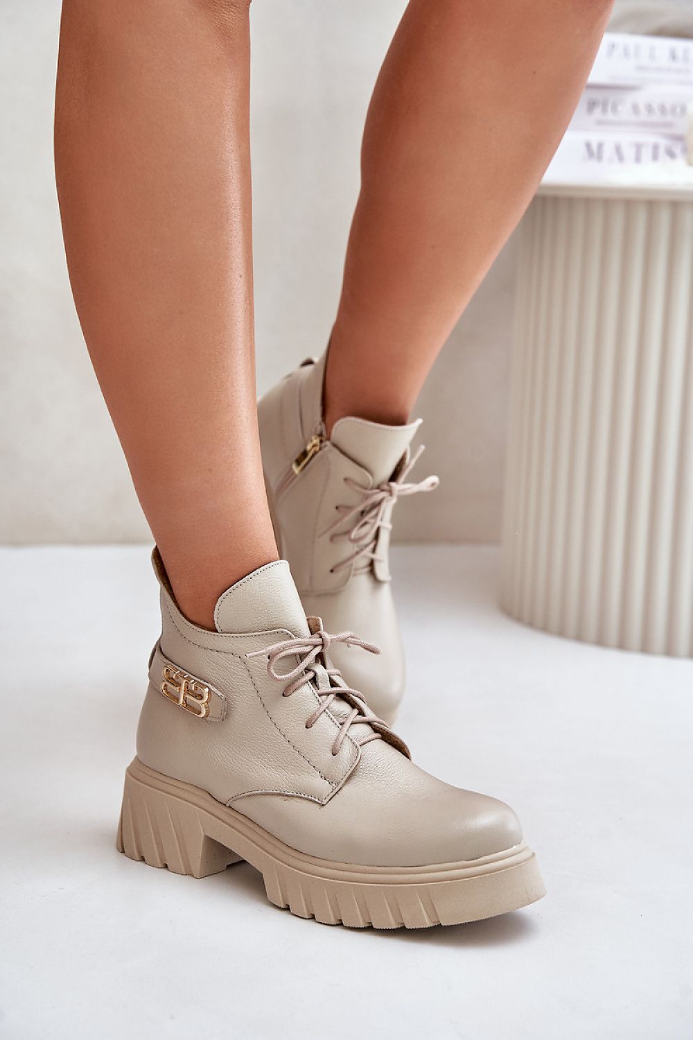 Elbira Felt-Lined Leather Boots in taupe with side zipper and front lacing, featuring a comfortable heel and platform for added height.