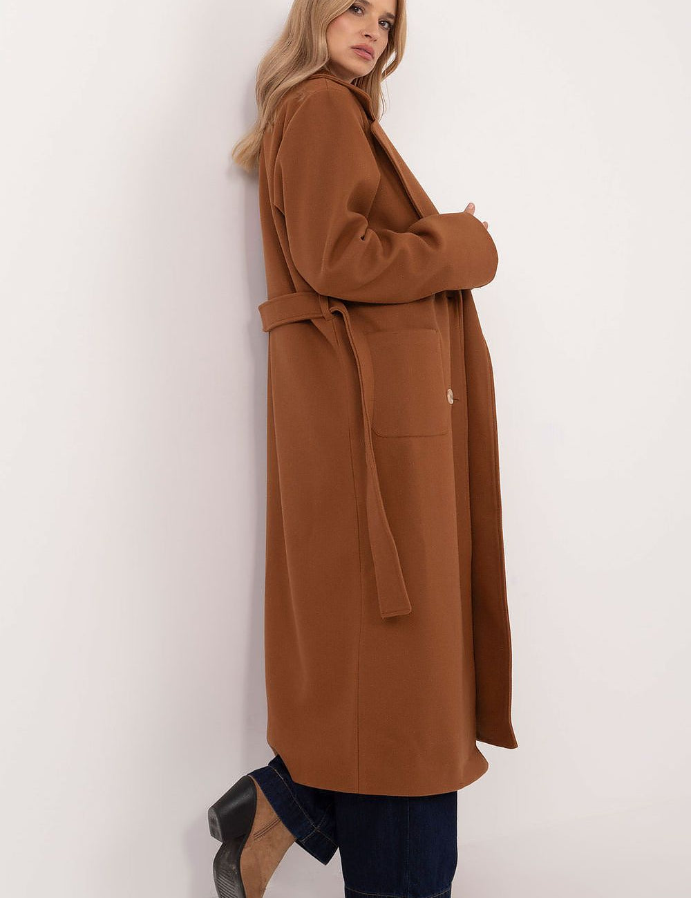 Woman wearing Olivanne Long Wool Blend Coat with wide lapels and waist tie, showcasing elegant autumn to spring fashion.