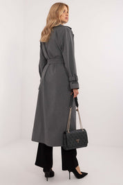 Elandra double-breasted trench coat in grey, styled for sophistication with a classic calf-length cut, perfect for work and formal occasions.