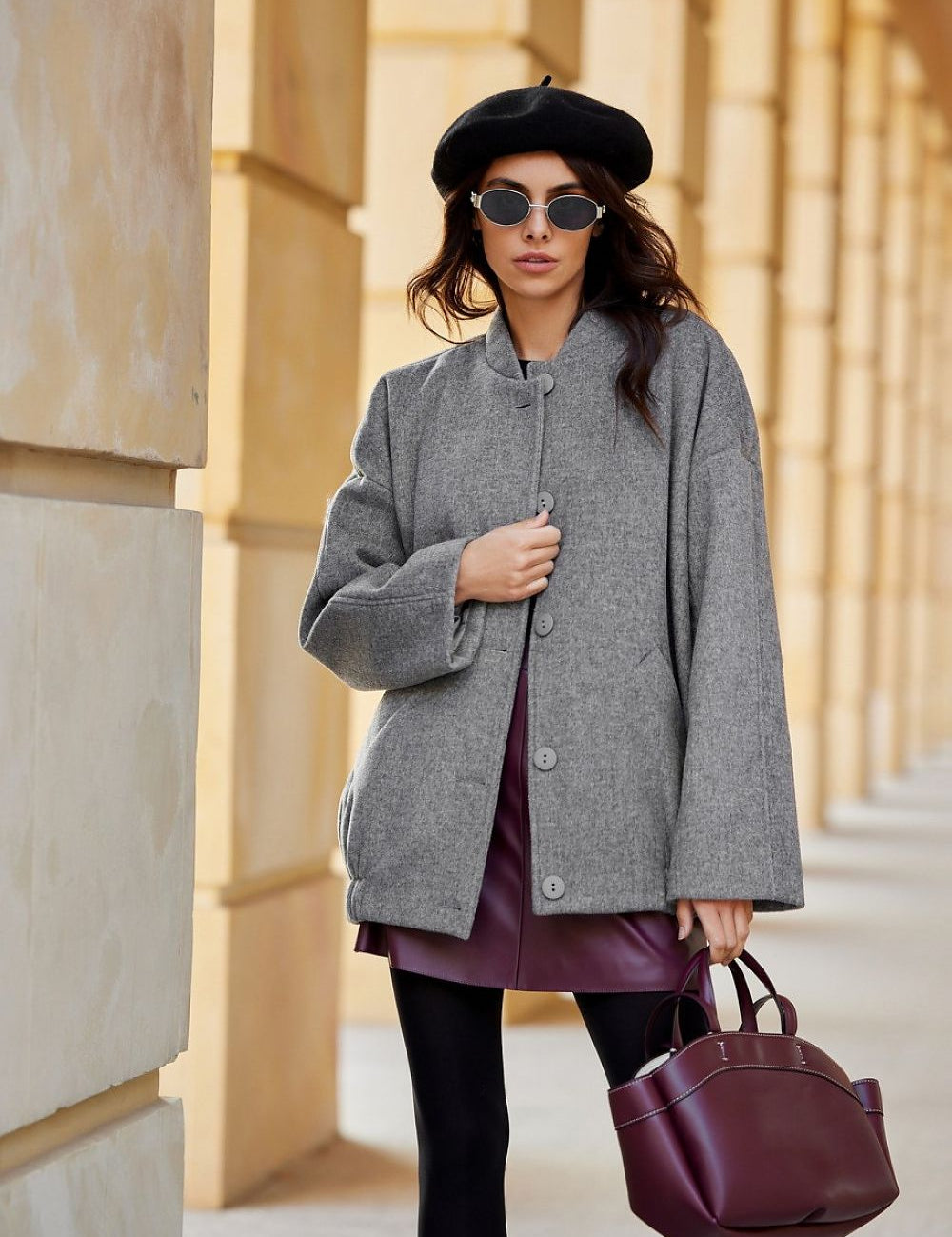 Woman wearing Vernelle Stand-Collar Buttoned Jacket with beret and sunglasses, showcasing elegant and relaxed style in urban setting.