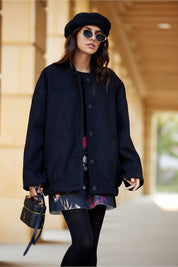 Woman wearing Vernelle Stand-Collar Buttoned Jacket, styled with a dress and beret, walking outdoors, showcasing casual elegance.