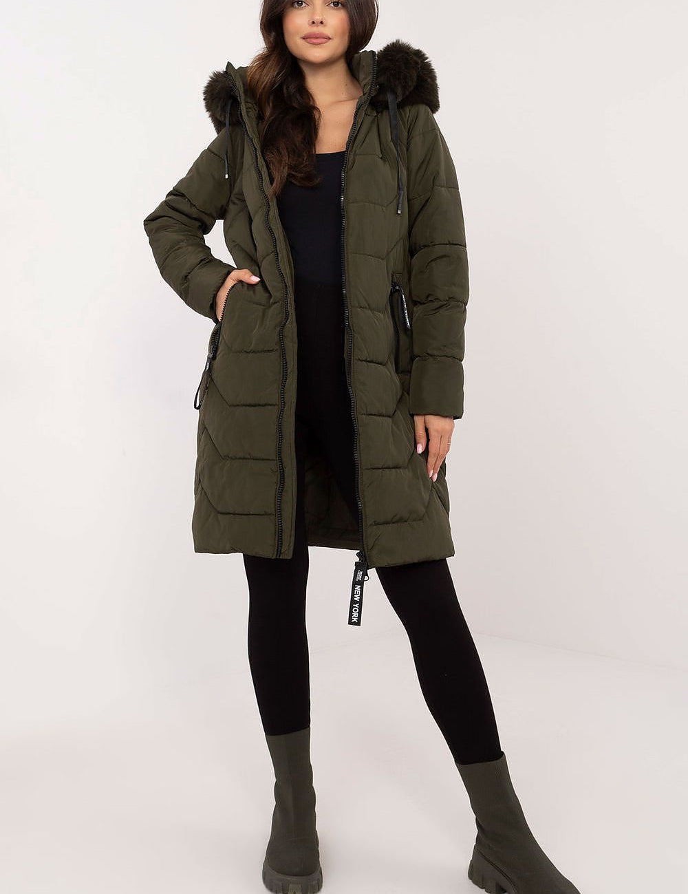 Woman wearing Elvarra Quilted Winter Down Coat with detachable hood and fur trim, perfect for autumn and winter style.