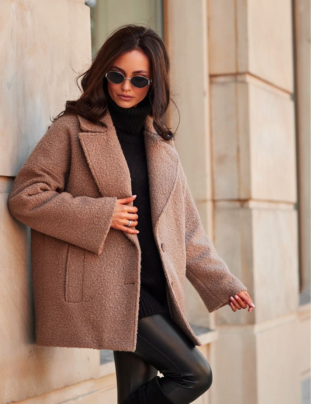 Woman wearing Lurevia Quilted Winter Jacket with sunglasses on a city street, showcasing stylish winter fashion.