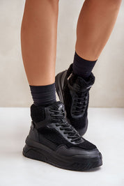 Valmara shearling high-top sneakers with faux sheepskin trim and platform sole, featuring lace and zipper closure for winter wear.