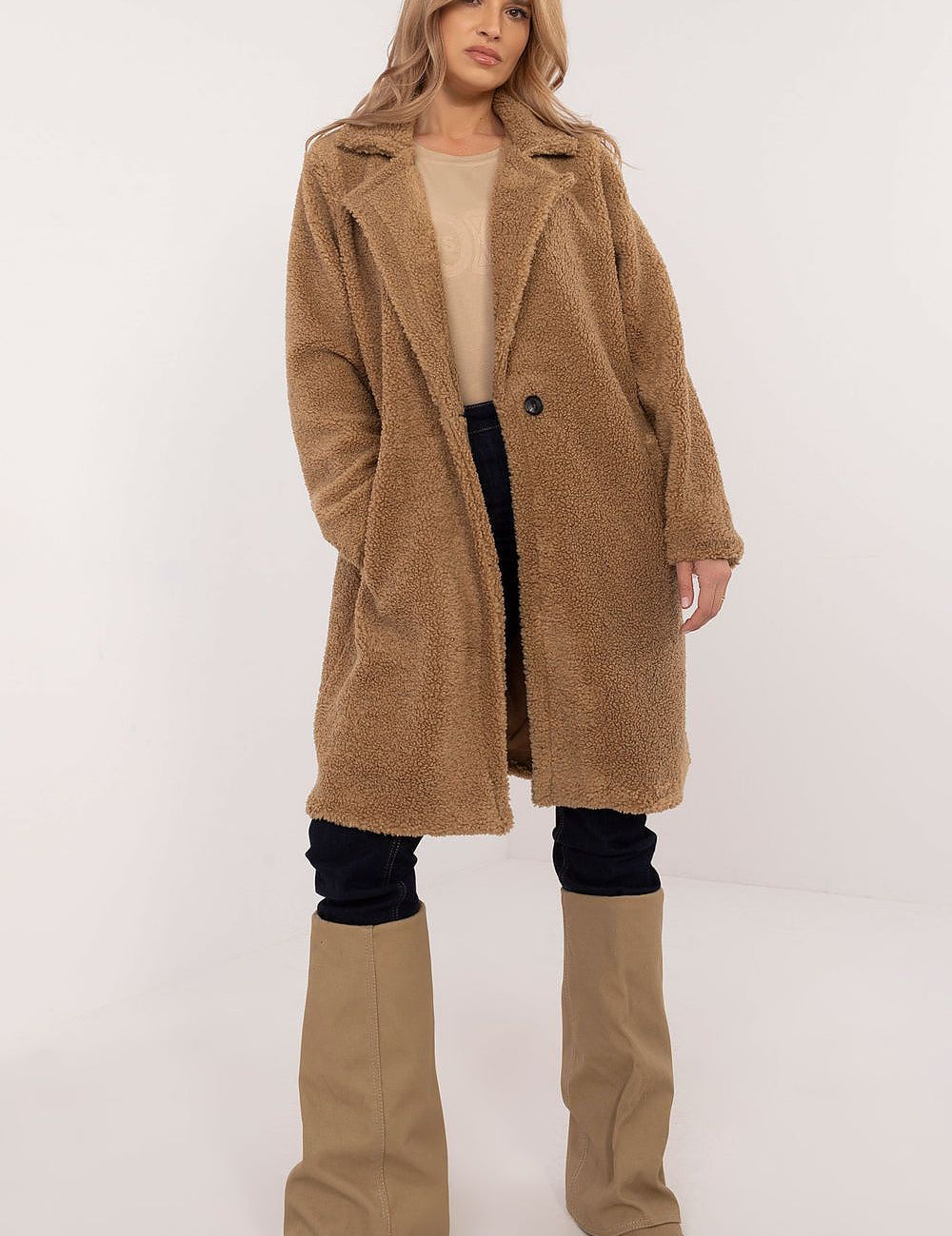 Woman wearing Elantra Pre-Knee Winter Coat, showcasing elegant and versatile design for autumn and winter wear.