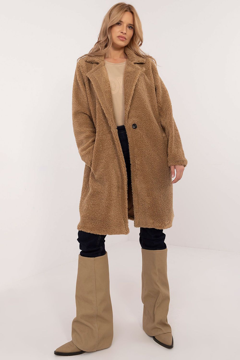 Woman wearing Elantra Pre-Knee Winter Coat, showcasing elegant and versatile design for autumn and winter wear.