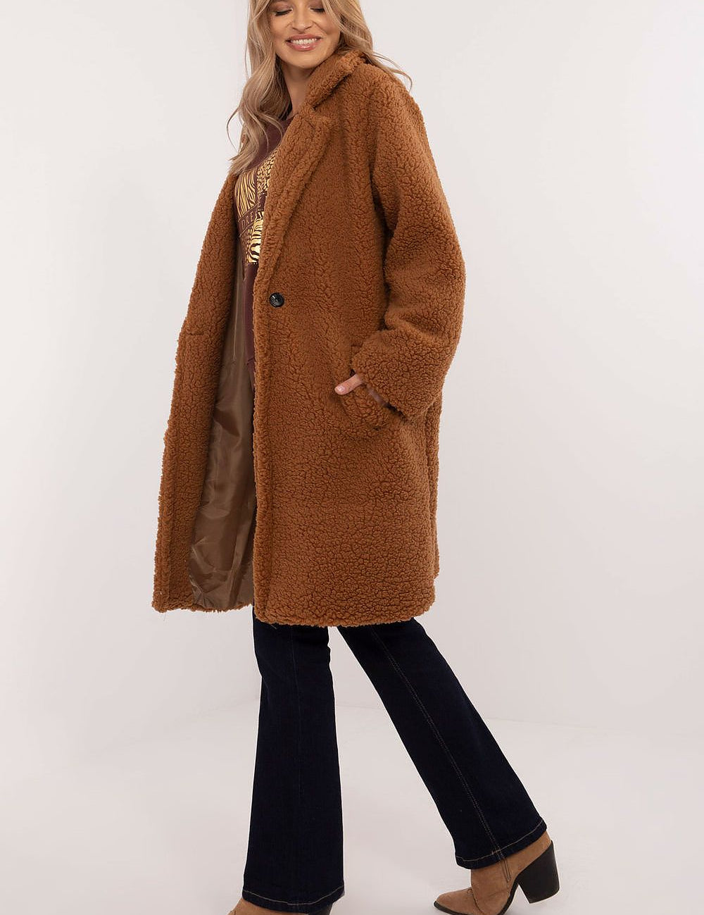 Woman wearing Elantra Pre-Knee Winter Coat in brown, showcasing its elegant design and warmth, ideal for autumn and winter fashion.