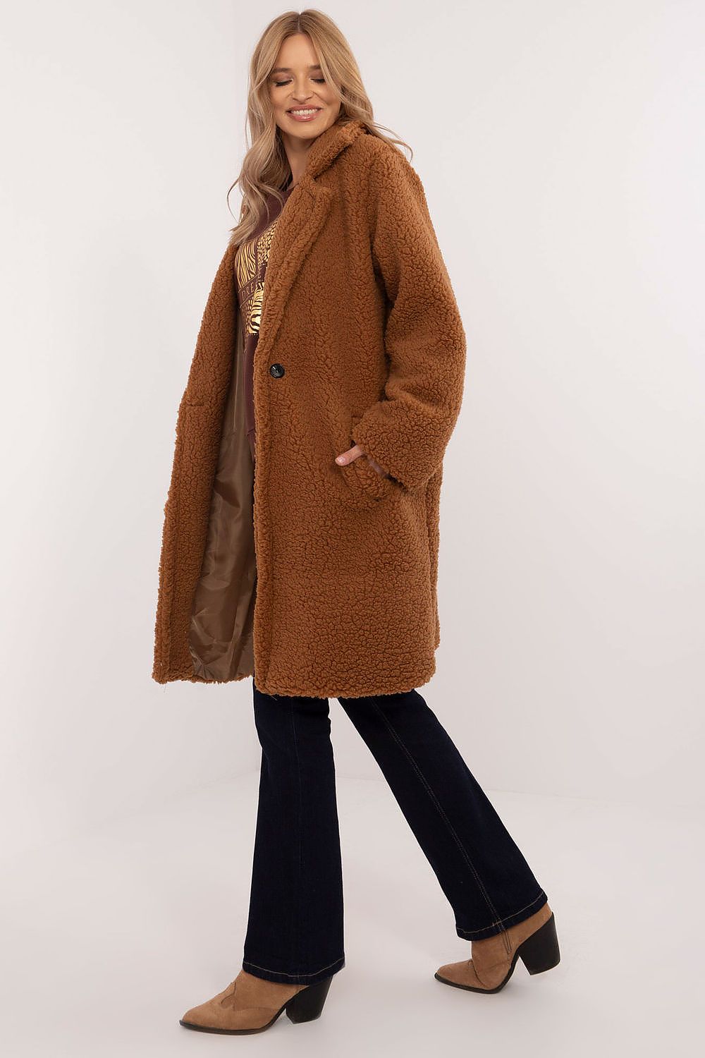 Woman wearing Elantra Pre-Knee Winter Coat in brown, showcasing its elegant design and warmth, ideal for autumn and winter fashion.