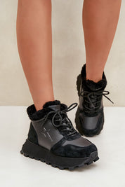 Alverra Winter Leather Sneakers in black, featuring plush fur lining, raised platform sole, and side zipper for cold-weather style and comfort.