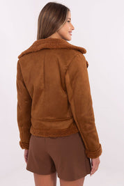 Woman wearing a brown insulated jacket with faux fur trim, showcasing back and shoulder details, perfect for autumn and winter style.