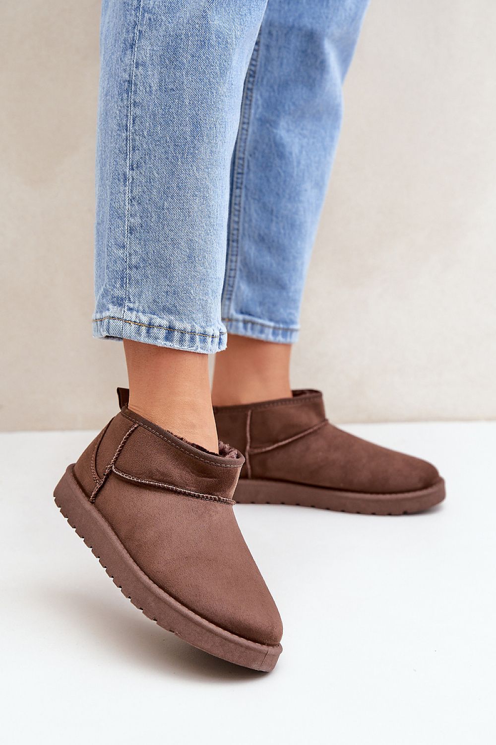 Morvenna brown suede snow boots with fur lining, shown on person wearing jeans, ideal for warmth and style in cold weather.