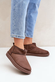 Morvenna brown suede snow boots with fur lining, shown on person wearing jeans, ideal for warmth and style in cold weather.