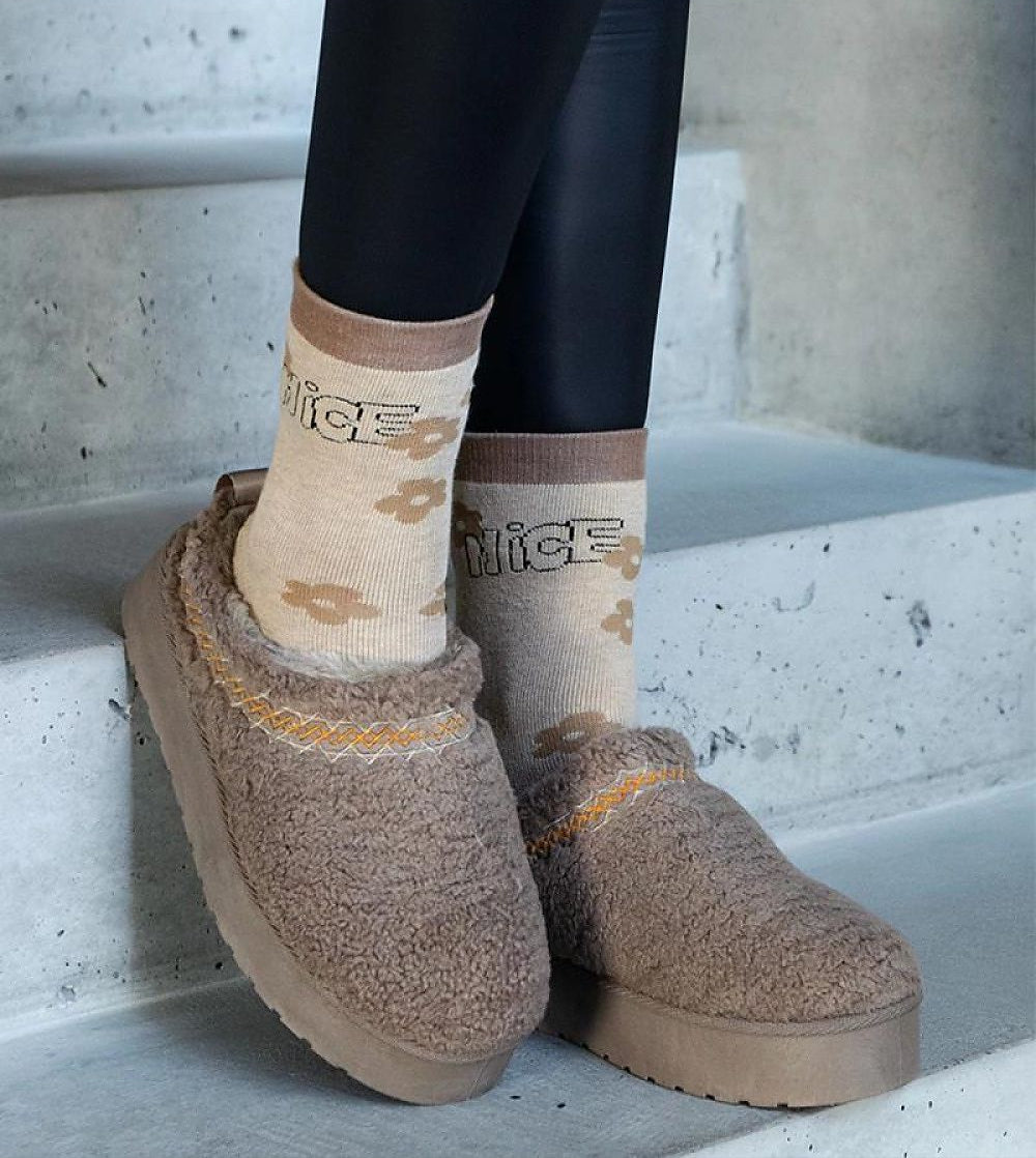 Women's brown embroidered winter snow boots with comfortable slip-on design, perfect for warmth and traction on cold days.