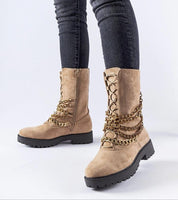 Selvaya chain-detail ankle boots on model, insulated for winter, with side zipper and eco leather, offering city style and warmth.