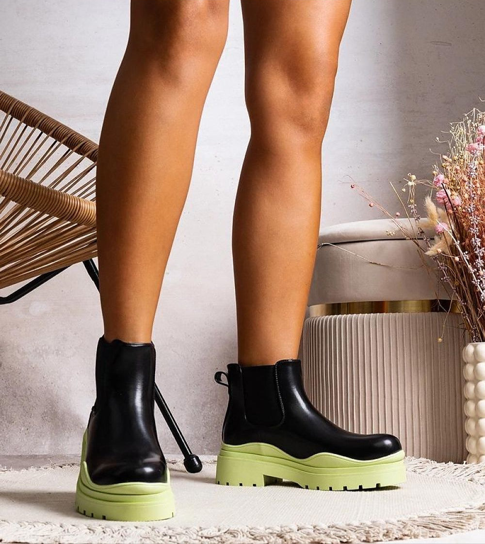 Tharelle slip-on ankle boots with rugged sole and elastic sides, crafted from vegan leather, perfect for autumn fashion.