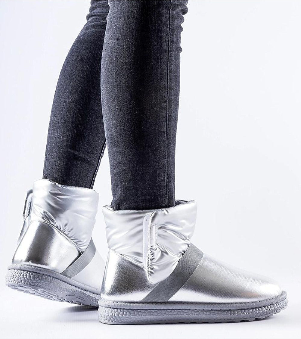 Brivona Glossy Velcro Snow Boots with insulated interior, shown on person wearing jeans, for winter elegance and waterproof protection.