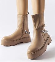 Guglielmo chain-trimmed flat ankle boots with beige sole and gold-tone chain embellishment, featuring side zipper closure.