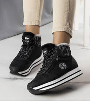 Navarros Insulated Street Boots in black eco leather with white sole and faux fur lining, offering comfort and style for winter wear.