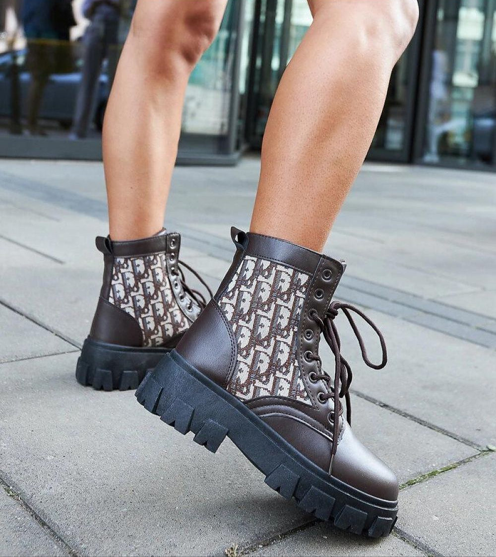 Ardenno platform lace-up boots in rich brown tones with chunky sole, ideal for transitional wardrobe, worn outdoors on city pavement.