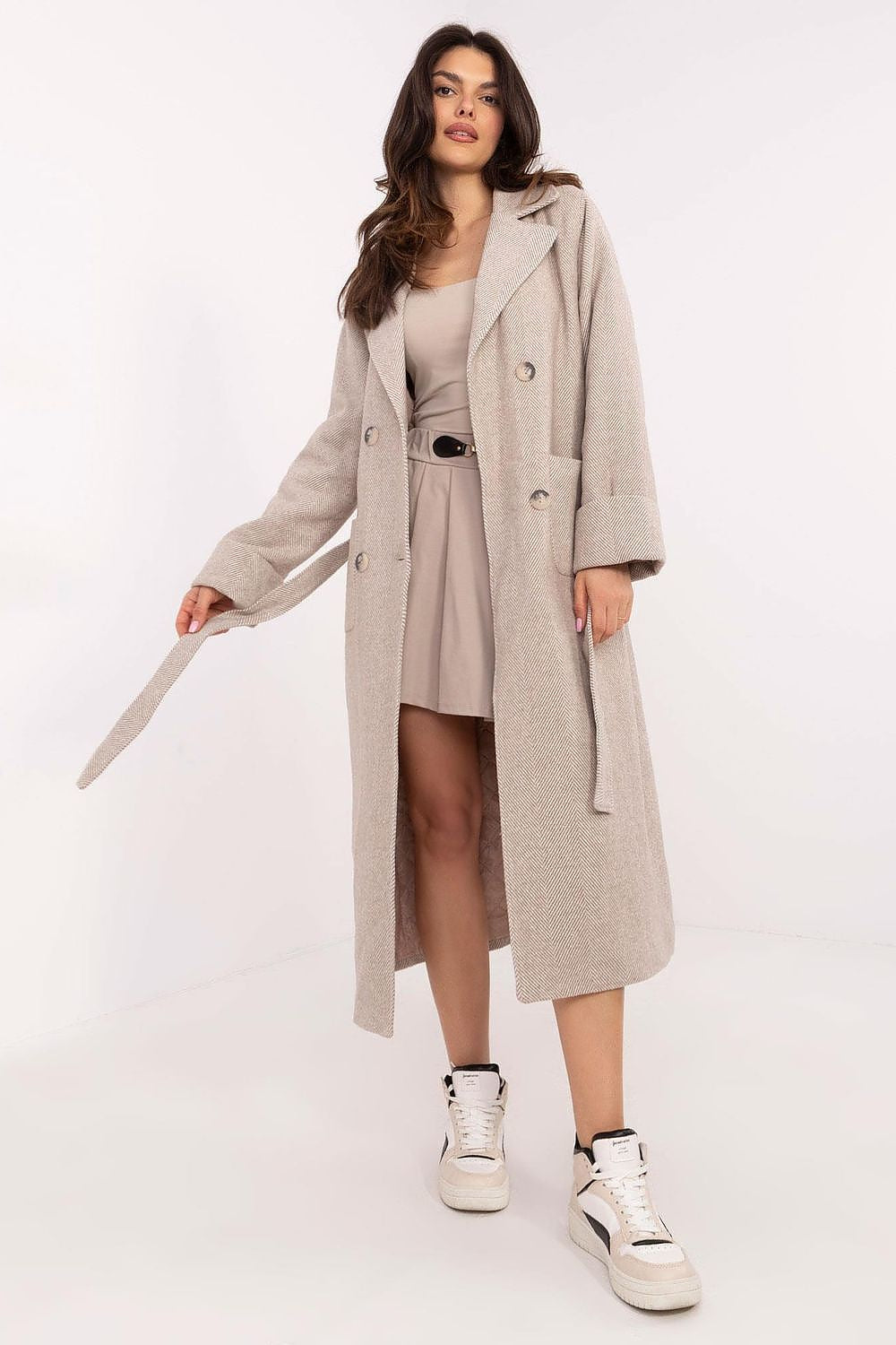 Woman wearing Selvarane Long Double-Breasted Wool Coat with belt, showcasing a stylish and elegant look.