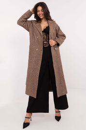Woman wearing a Selvarane Long Double-Breasted Wool Coat with belted waist and fine stripes, styled elegantly over black attire.