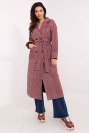 Woman wearing Selvarane Long Double-Breasted Wool Coat with belt, standing in a stylish pose, showcasing fine stripe pattern and long sleeves.