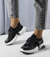Woman wearing Nyvelta Stretch Knit Sole Sneakers with a sock-like upper, lightweight breathable design, and 4 cm platform sole.
