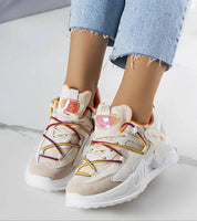 Yllendra Mixed Texture Platform Sneakers with colorful laces, eco leather upper, and 5 cm rubber sole, paired with denim jeans.