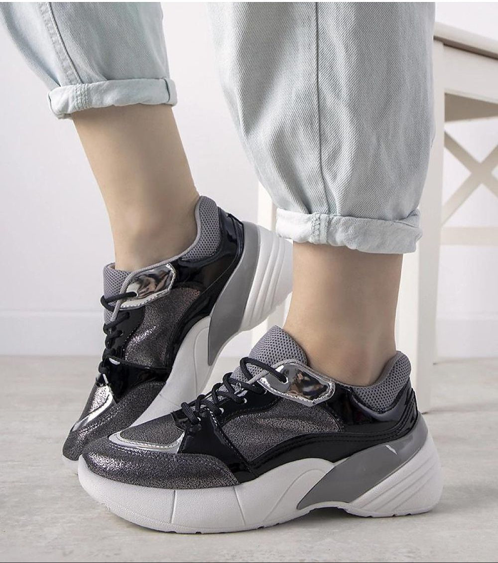 Zelphira Metallic Contrast Platform Sneakers with high white sole and silver-toned eco leather, featuring lace-up closure and sculptural overlays.