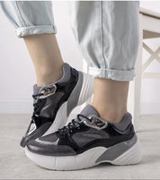 Zelphira Metallic Contrast Platform Sneakers with high white sole and silver-toned eco leather, featuring lace-up closure and sculptural overlays.