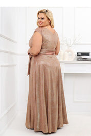 Back view of Auravelle Plus Size Evening Dress in blush, featuring V-neckline and tie waist, perfect for events like weddings or galas.