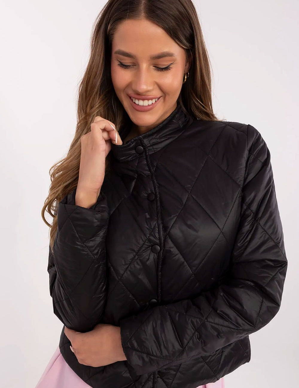 Woman wearing Alverise Quilted Snap-Front Jacket in black, showcasing a wind-resistant, hoodless design with a modern, casual style.