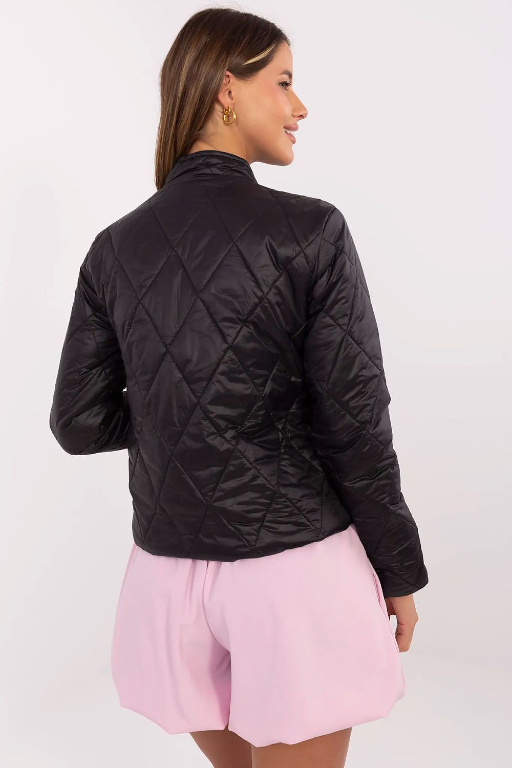 Woman wearing black Alverise Quilted Snap-Front Jacket, showing back view. Lightweight nylon, modern and casual style jacket.
