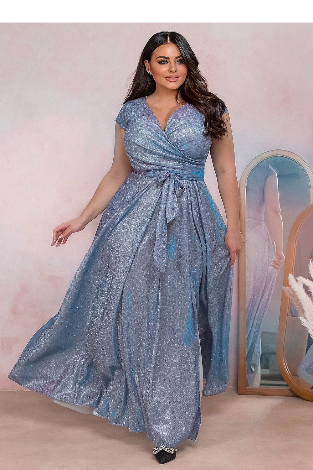 Auravelle Plus Size Evening Dress in shimmering blush, wrap-style V-neck, tie waist, flowing skirt with high slit, ideal for events.