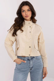 Woman wearing Corvaline Lightweight Windbreaker Jacket with jeans, showcasing its versatile style for spring and summer seasons.