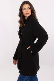 Selvarinne Double-Breasted Short Coat with waist tie and decorative brooch, perfect for transitional wear. Model wearing black coat.