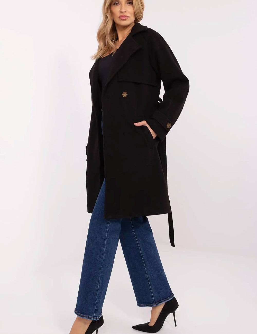 Model wearing Corvanne Double-Breasted Belted Coat, knee-length polyester, stylish for transitional seasons, refined woven stripe fabric.