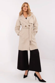 Model wearing Corvanne Double-Breasted Belted Coat with knee-length straight cut and slip pockets, ideal for transitional seasons.