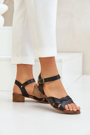 Valerinne cross-strap leather sandals with low block heel and adjustable ankle closure, ideal for summer elegance and comfort.